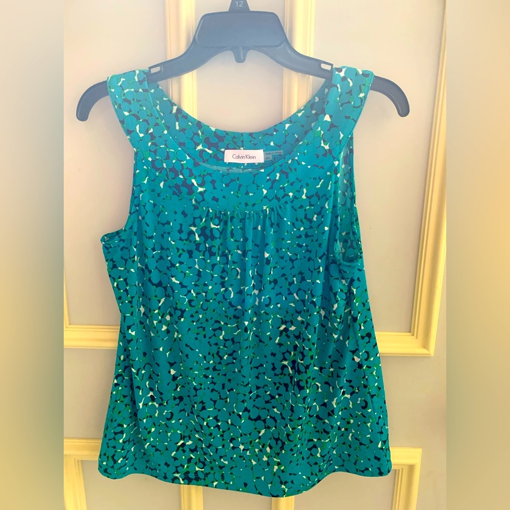 Teal with green and black polyester sleeveless top.